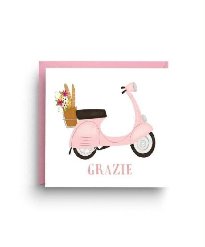 Light pink Vespa with a basket on the back carrying a bouquet of flowers and a baguette.  Text below the Vespa saying "grazie".